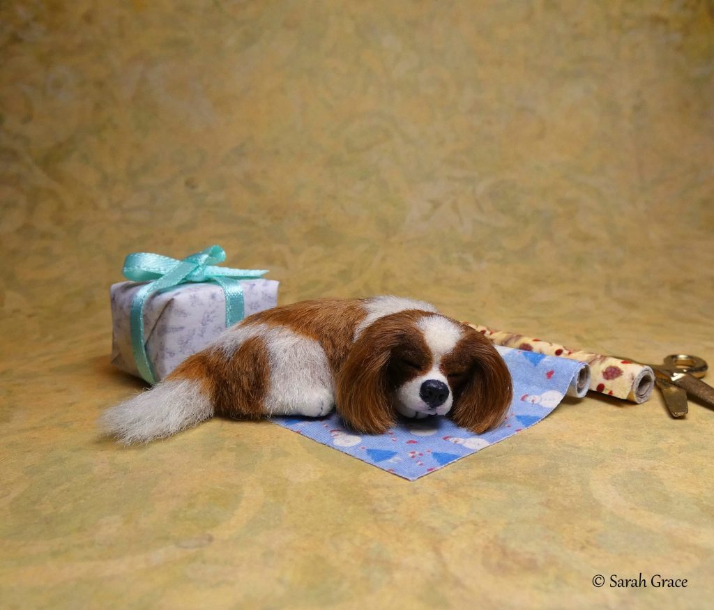 Realistic 1:12 scale miniature Cavalier King Charles Spaniel dog sculpture by Sarah Grace